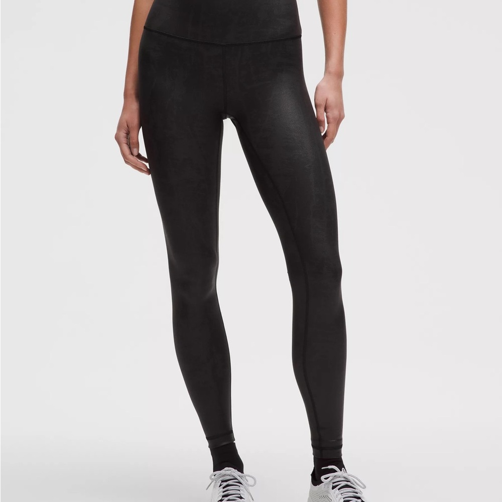Never worn Black Women's Leggings. 
Wunder Train HR Tight 28" *Matte Foil MIBA 6